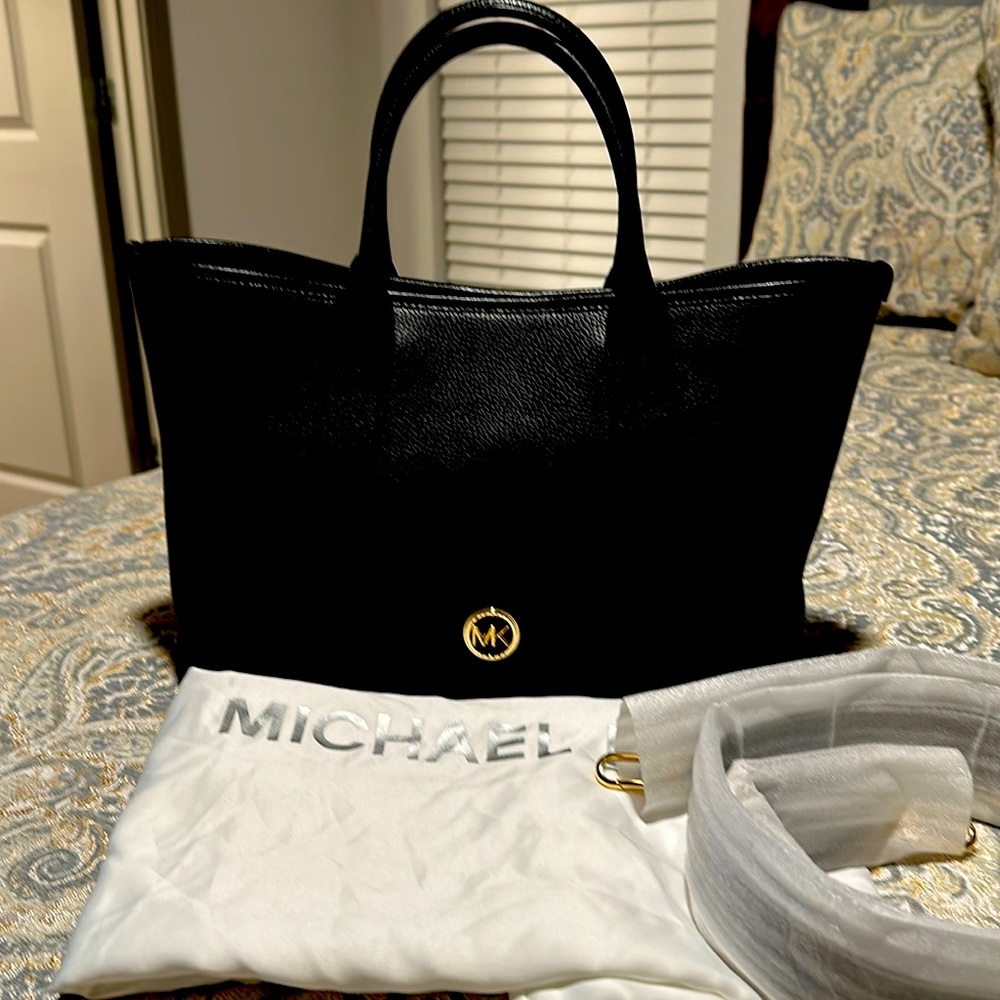 This is a medium sized Michael Kors bag used twice